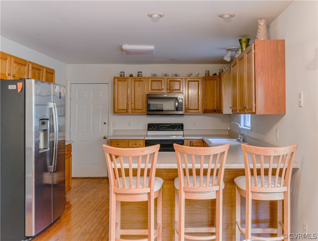 3833 Dunraven Road Chesterfield, VA 23236 - Photo 13 of 39 a kitchen with stainless steel appliances granite countertop a dining table and chairs
