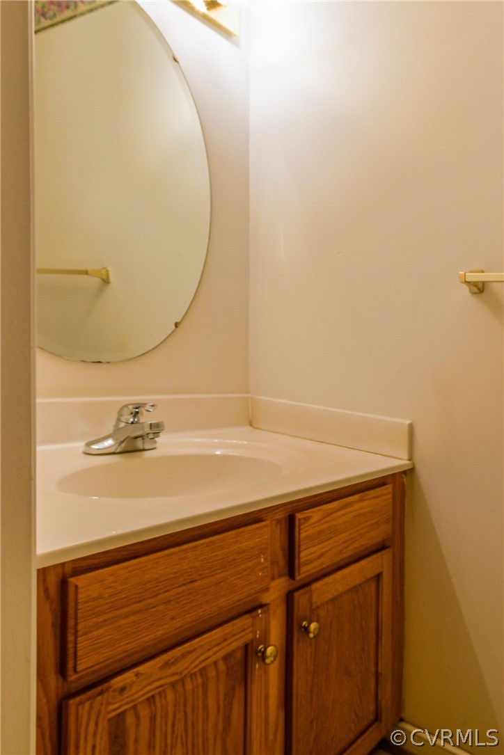 3833 Dunraven Road Chesterfield, VA 23236 - Photo 15 of 39 a bathroom with a sink and a mirror