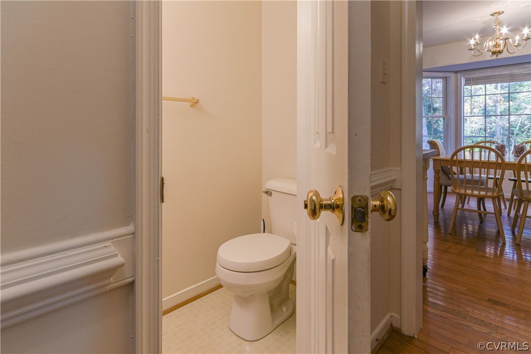 3833 Dunraven Road Chesterfield, VA 23236 - Photo 16 of 39 a bathroom with a toilet and a shower curtain