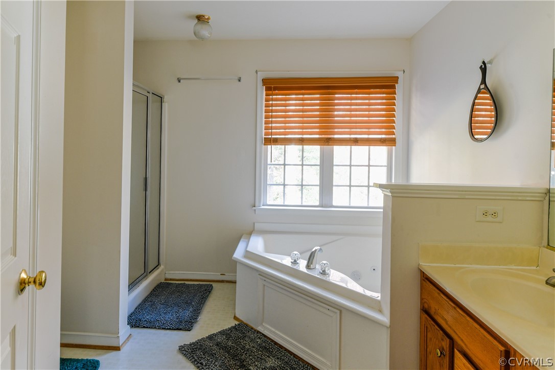 3833 Dunraven Road Chesterfield, VA 23236 - Photo 18 of 39 a bathroom with a sink and a tub