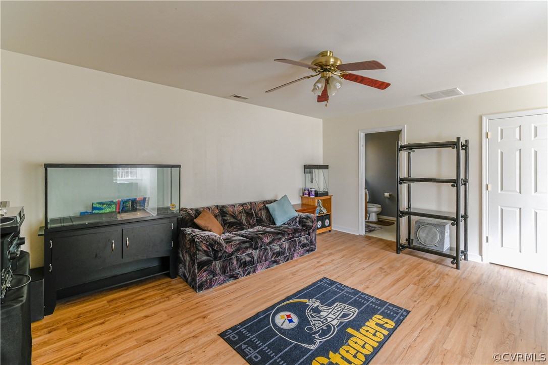 3833 Dunraven Road Chesterfield, VA 23236 - Photo 20 of 39 a living room with furniture and a wooden floor