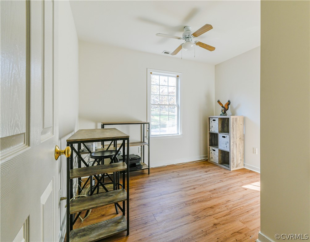 3833 Dunraven Road Chesterfield, VA 23236 - Photo 25 of 39 a view of an empty room with a window and wooden floor