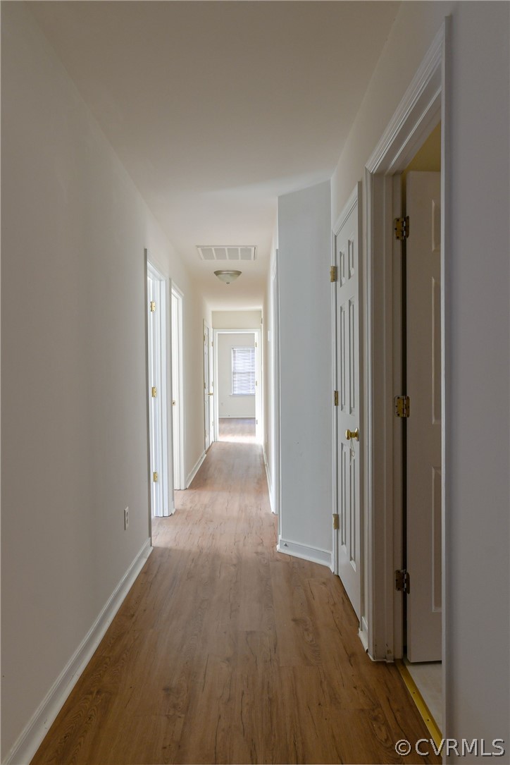 3833 Dunraven Road Chesterfield, VA 23236 - Photo 27 of 39 a view of a hallway with wooden floor and closet