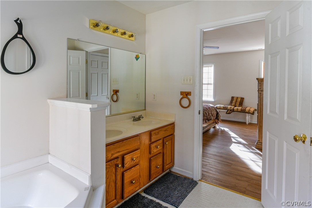 3833 Dunraven Road Chesterfield, VA 23236 - Photo 33 of 39 a en suite bathroom with a double vanity sink and a mirror