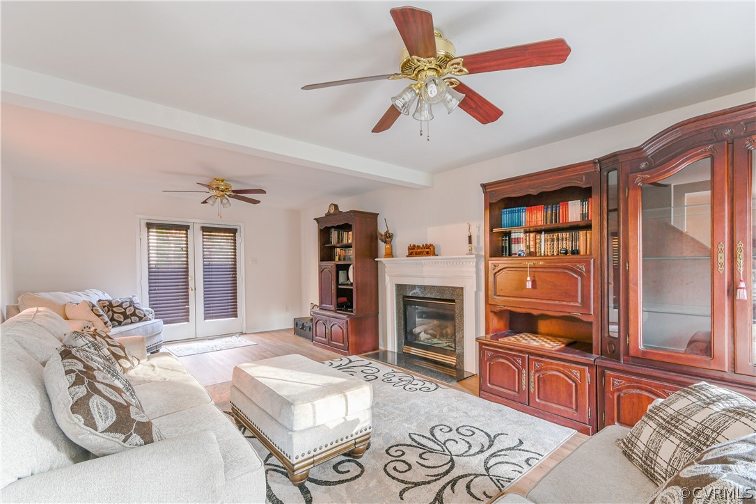 3833 Dunraven Road Chesterfield, VA 23236 - Photo 5 of 39 a bedroom with furniture and a flat screen tv