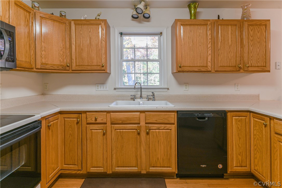 3833 Dunraven Road Chesterfield, VA 23236 - Photo 10 of 39 a kitchen with stainless steel appliances granite countertop a sink and cabinets