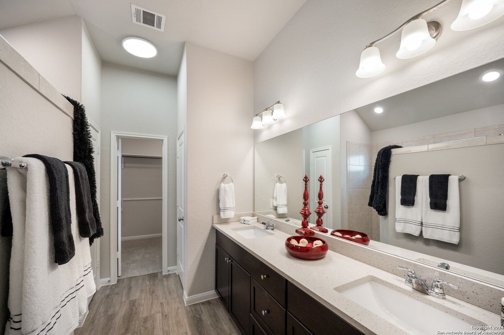 3110 Blenheim Park Bulverde, TX 78163 - Photo 11 of 20 a bathroom with a double vanity sink and mirror