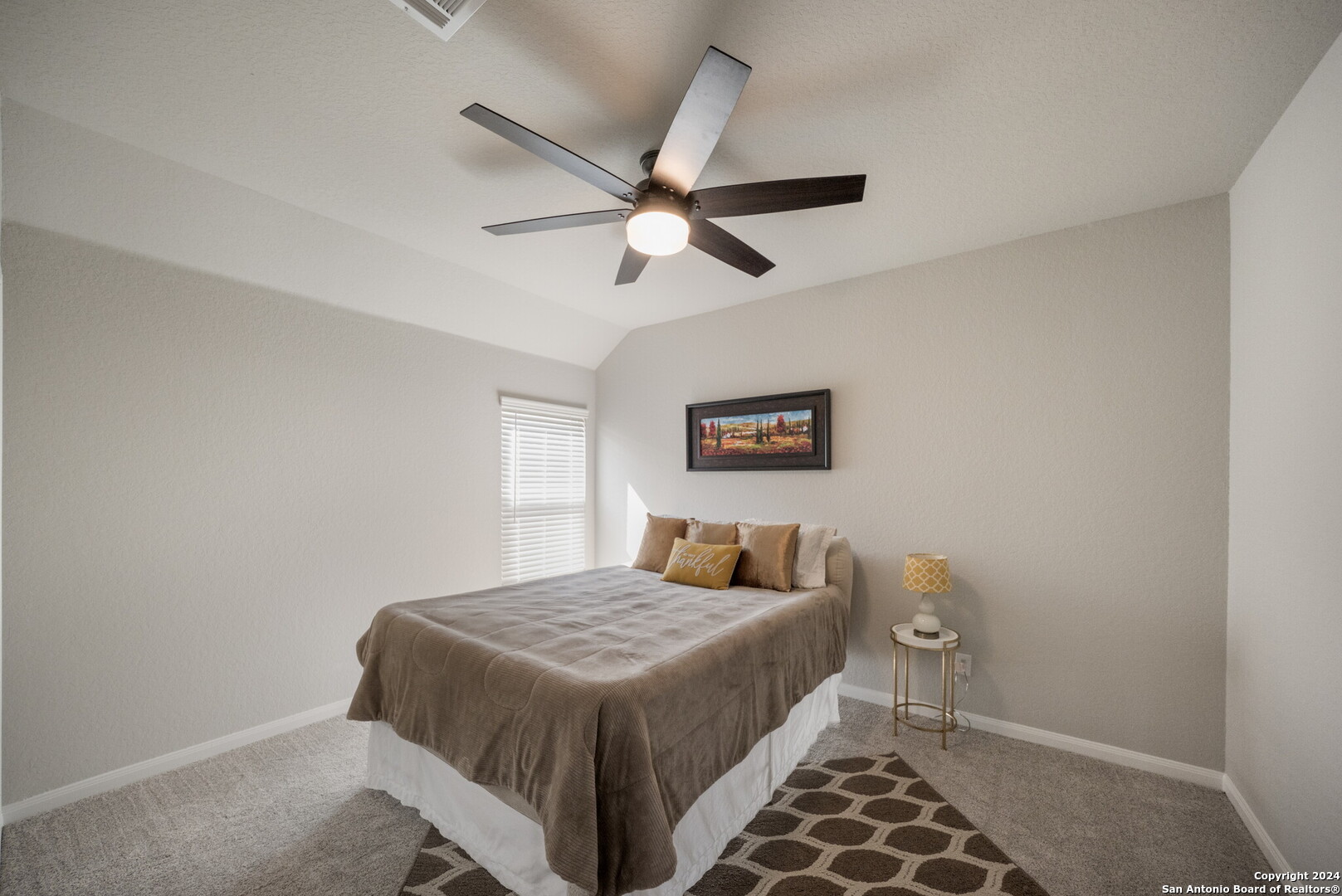 3110 Blenheim Park Bulverde, TX 78163 - Photo 14 of 20 a bedroom with a bed and a painting on the wall