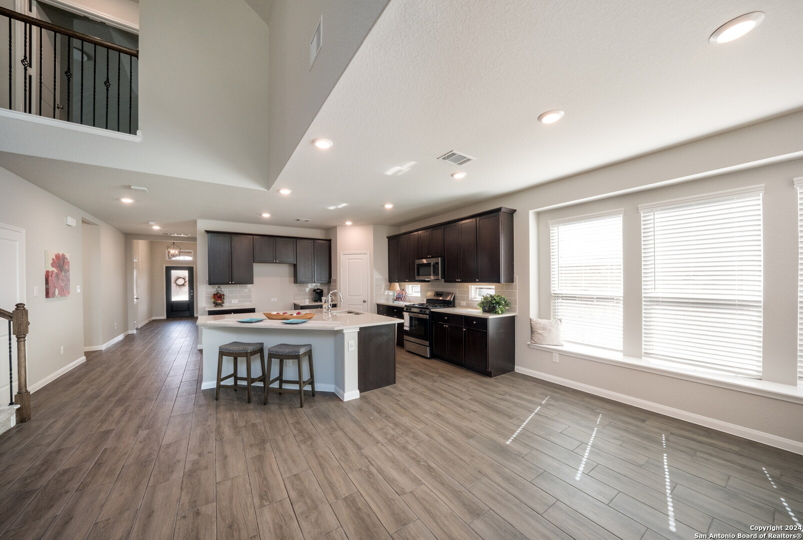 3110 Blenheim Park Bulverde, TX 78163 - Photo 7 of 20 a living room with stainless steel appliances furniture wooden floor and a kitchen view
