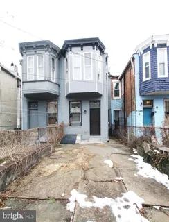 a front view of a house with yard