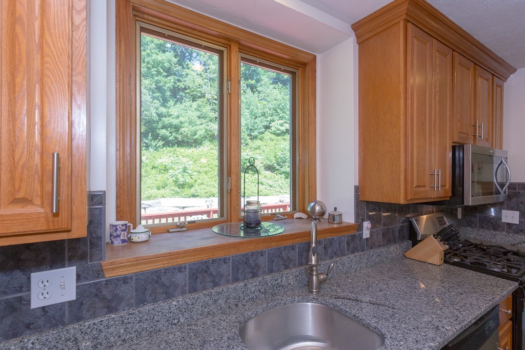 88 Providence Road Westford, MA 01886 - Photo 13 of 29 a kitchen with sink a window and couch