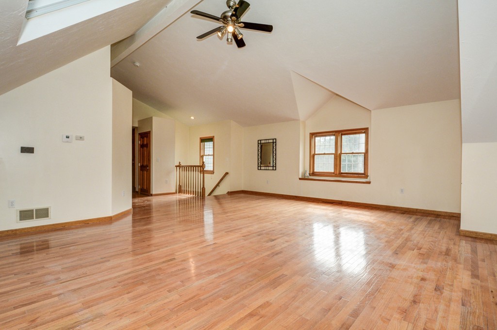 88 Providence Road Westford, MA 01886 - Photo 15 of 29 a view of empty room with wooden floor and fan