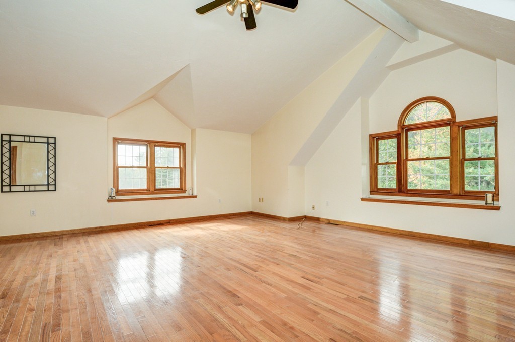 88 Providence Road Westford, MA 01886 - Photo 16 of 29 a view of an empty room with a window and wooden floor