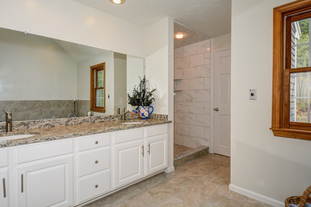 88 Providence Road Westford, MA 01886 - Photo 18 of 29 a bathroom with a granite countertop sink and a mirror