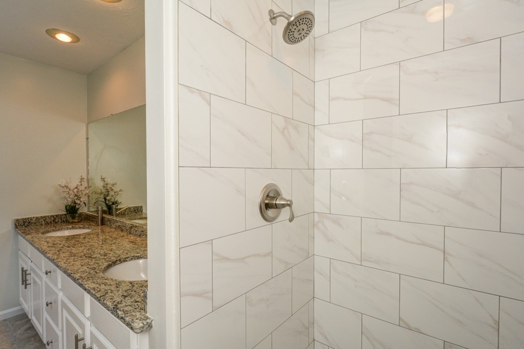 88 Providence Road Westford, MA 01886 - Photo 19 of 29 a bathroom with a granite countertop shower a mirror and vanity