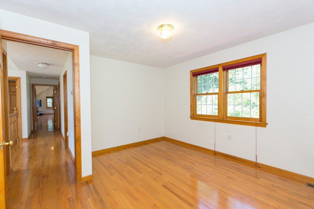 88 Providence Road Westford, MA 01886 - Photo 23 of 29 wooden floor in an empty room with a window