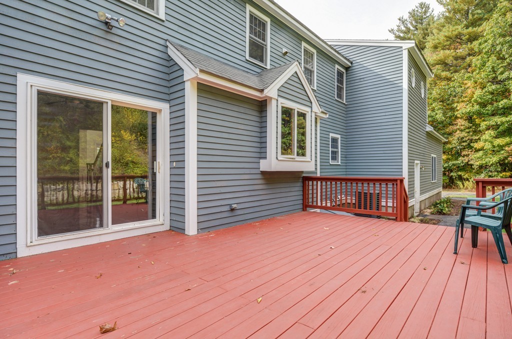88 Providence Road Westford, MA 01886 - Photo 27 of 29 a view of backyard with deck and wooden floor
