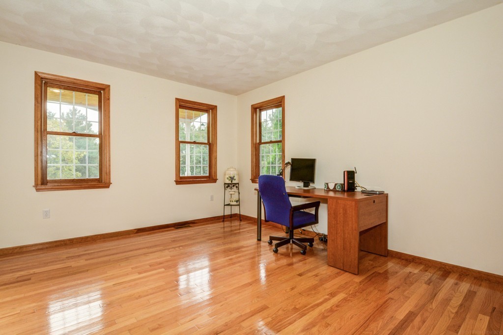 88 Providence Road Westford, MA 01886 - Photo 9 of 29 a view of a workspace with furniture and a window