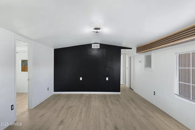 a view of a livingroom with wooden floor