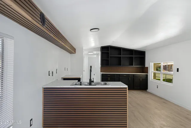 a view of a hallway with seating space