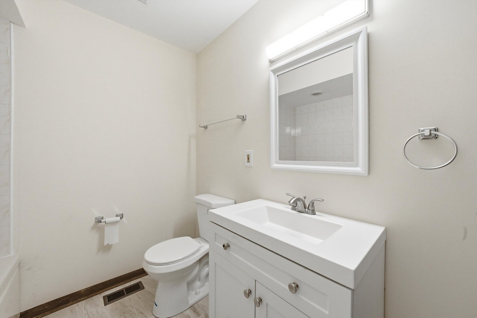 831 Violet Lane Matteson, IL 60443 - Photo 12 of 21 a bathroom with a sink vanity mirror and toilet