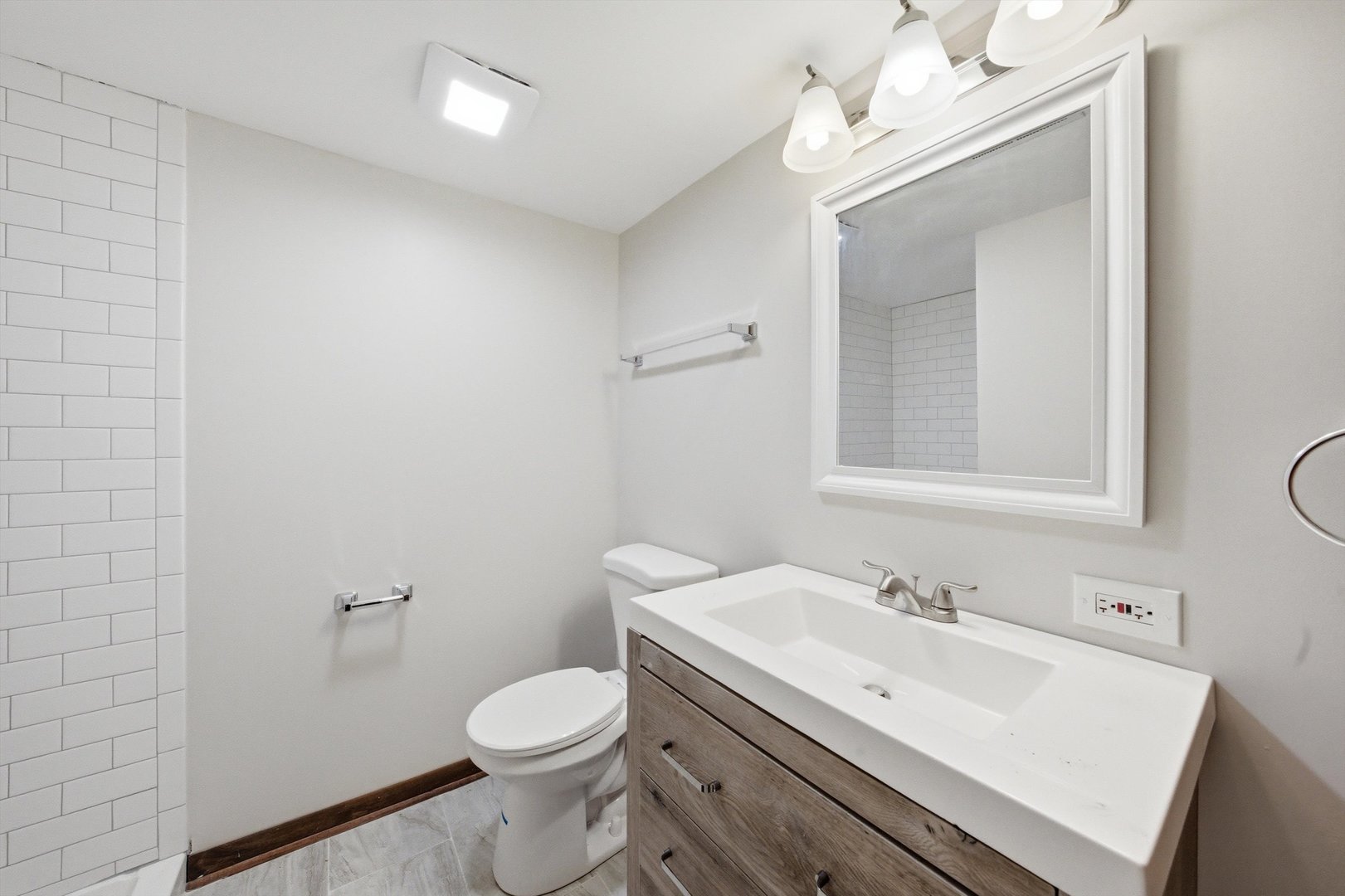 831 Violet Lane Matteson, IL 60443 - Photo 9 of 21 a bathroom with a sink a toilet and mirror