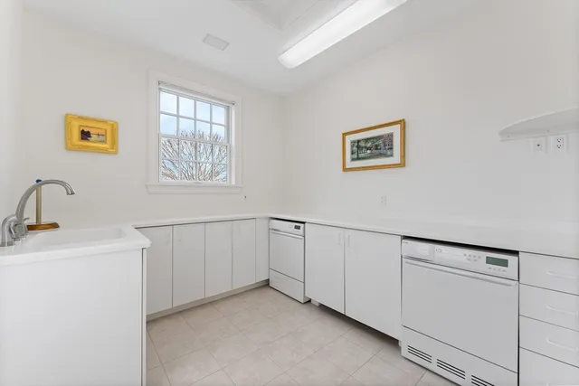 a bathroom with a toilet sink vanity and mirror