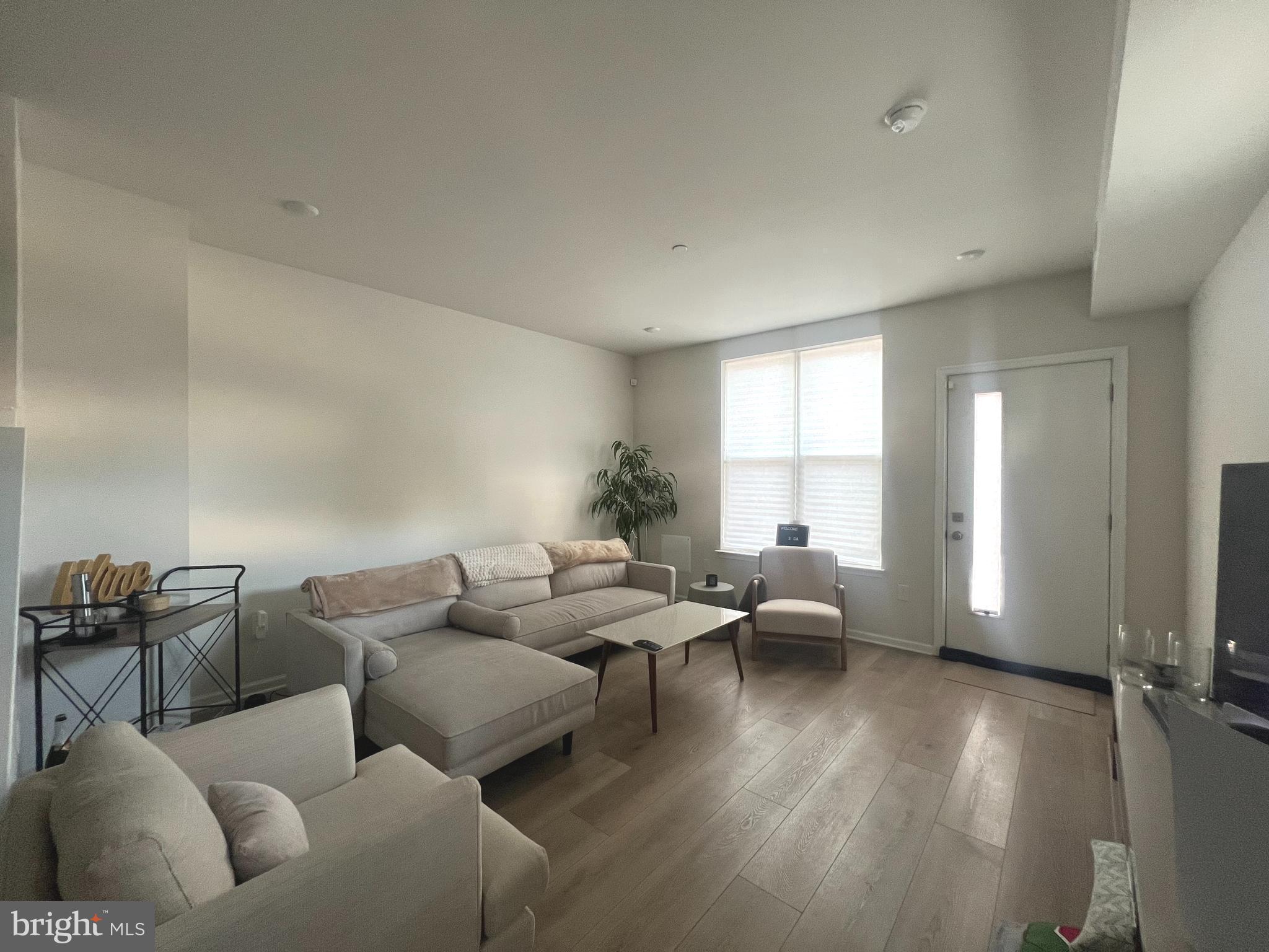 2700 Sears Street Philadelphia, PA 19146 - Photo 2 of 10 a living room with furniture and a large window