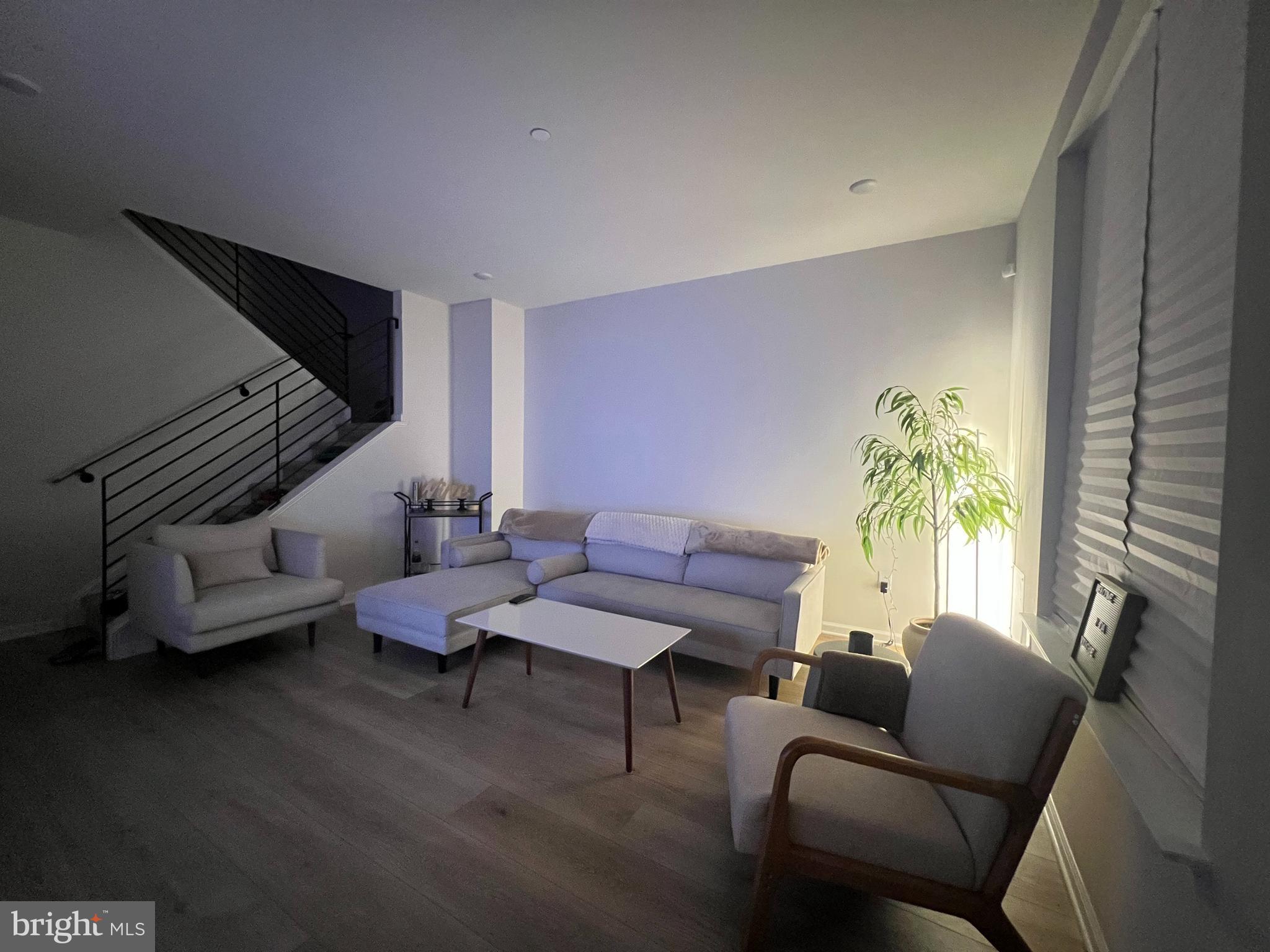 2700 Sears Street Philadelphia, PA 19146 - Photo 10 of 10 a living room with furniture and a potted plant