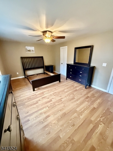 150 Karrville Road Port Murray, NJ 07865 - Photo 19 of 40 a bedroom with a bed and a mirror