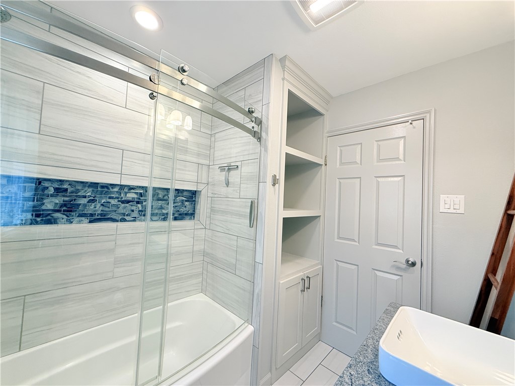 126 Marie Place Portland, TX 78374 - Photo 22 of 40 a bathroom with a bathtub and a shower