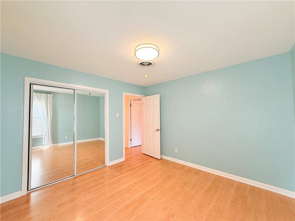 126 Marie Place Portland, TX 78374 - Photo 26 of 40 an empty room with closet and fan