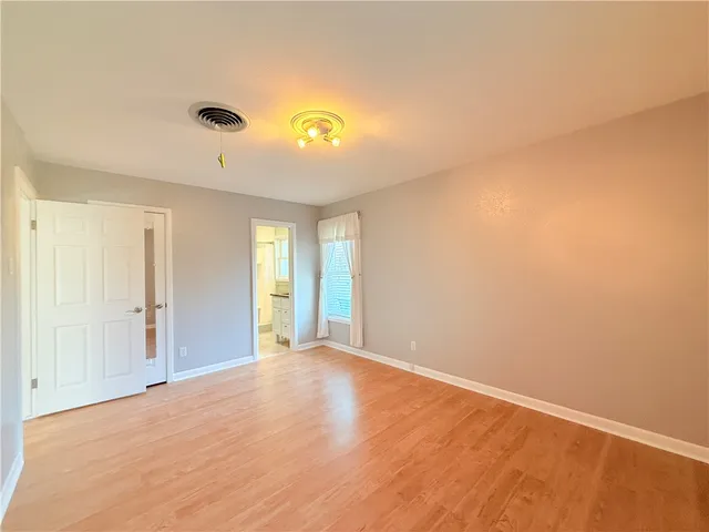 a view of an empty room and window