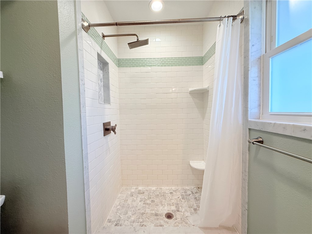 126 Marie Place Portland, TX 78374 - Photo 36 of 40 a bathroom with a shower and a sink