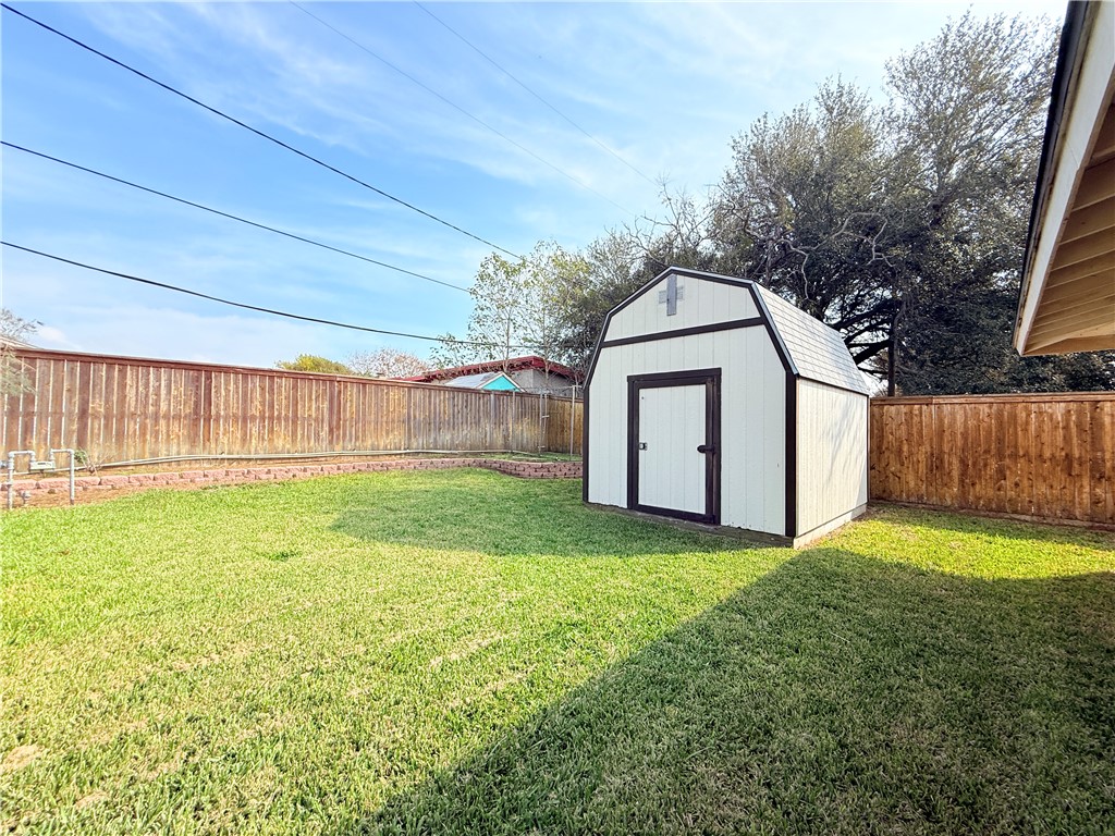 126 Marie Place Portland, TX 78374 - Photo 39 of 40 a view of a backyard with small cabin