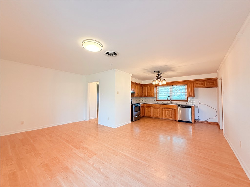126 Marie Place Portland, TX 78374 - Photo 7 of 40 a view of a room with cabinet and a fireplace