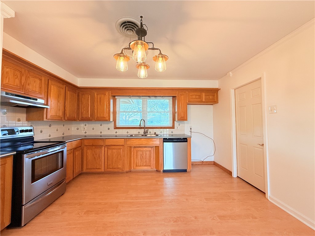 126 Marie Place Portland, TX 78374 - Photo 9 of 40 a large kitchen with a large window