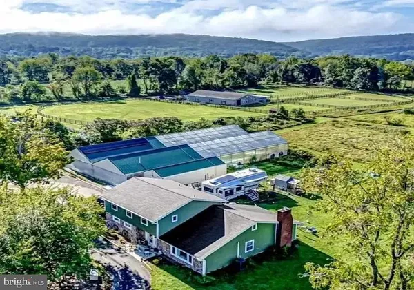 a aerial view of a house with big yard