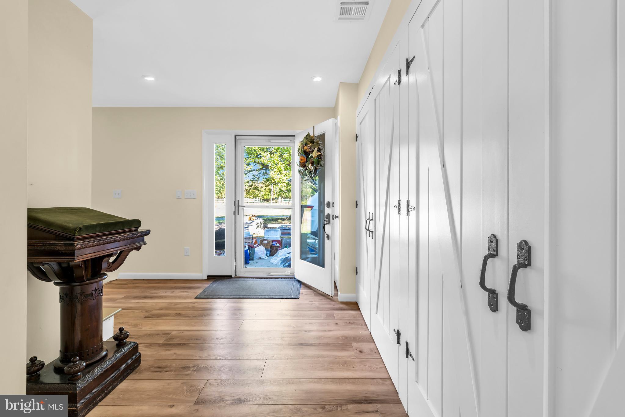 70 MacKenzie Road Hampton, NJ 08827 - Photo 18 of 45 a view of a hallway to a livingroom with wooden floor and furniture