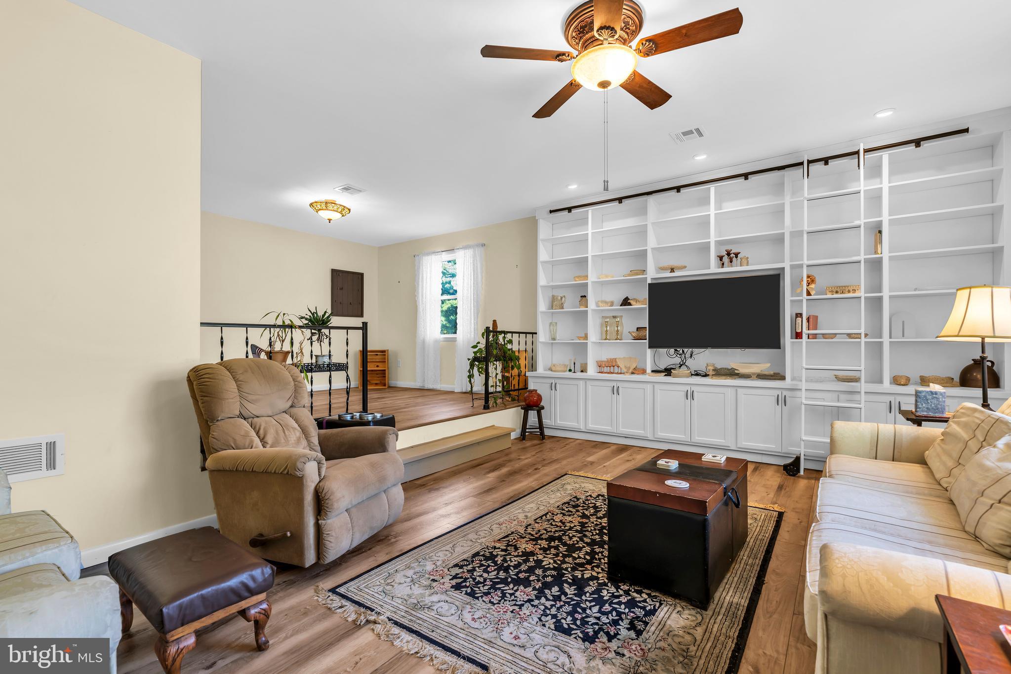 70 MacKenzie Road Hampton, NJ 08827 - Photo 21 of 45 a living room with furniture and a flat screen tv