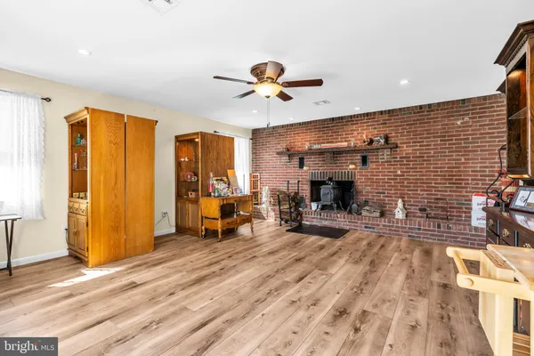 a view of a livingroom with furniture and workspace