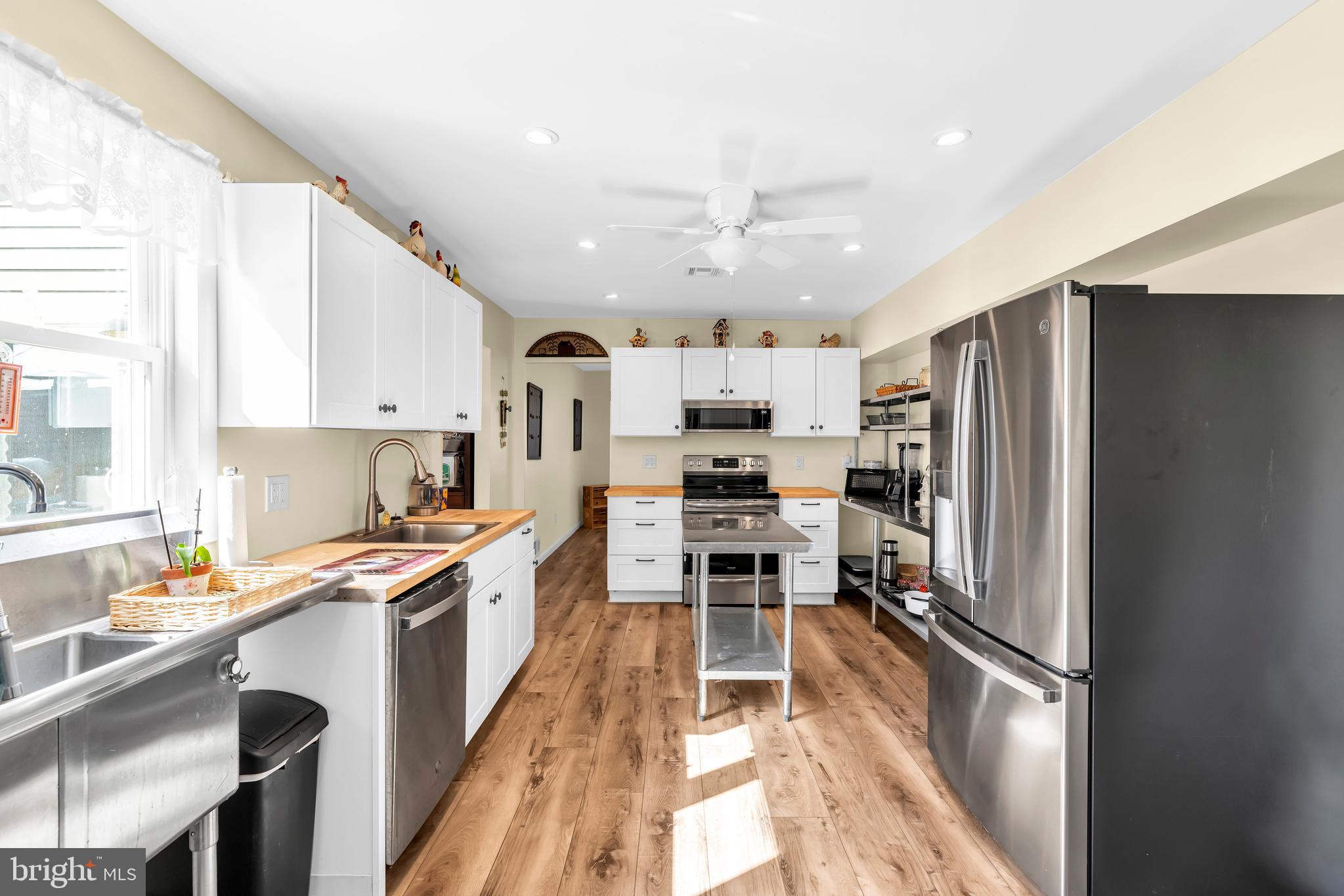 70 MacKenzie Road Hampton, NJ 08827 - Photo 31 of 45 a kitchen with stainless steel appliances a refrigerator stove microwave and cabinets