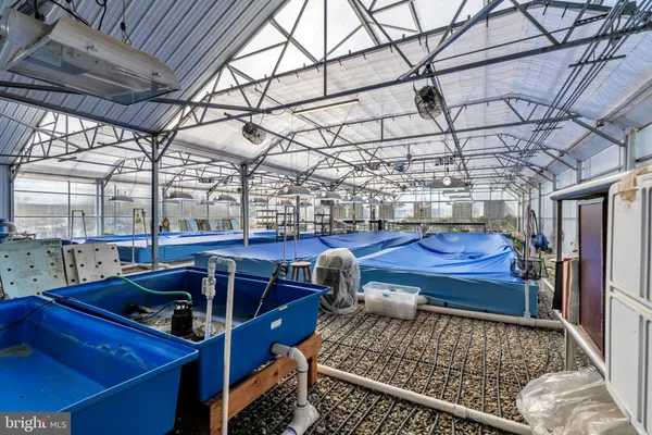 a roof deck with table and chairs