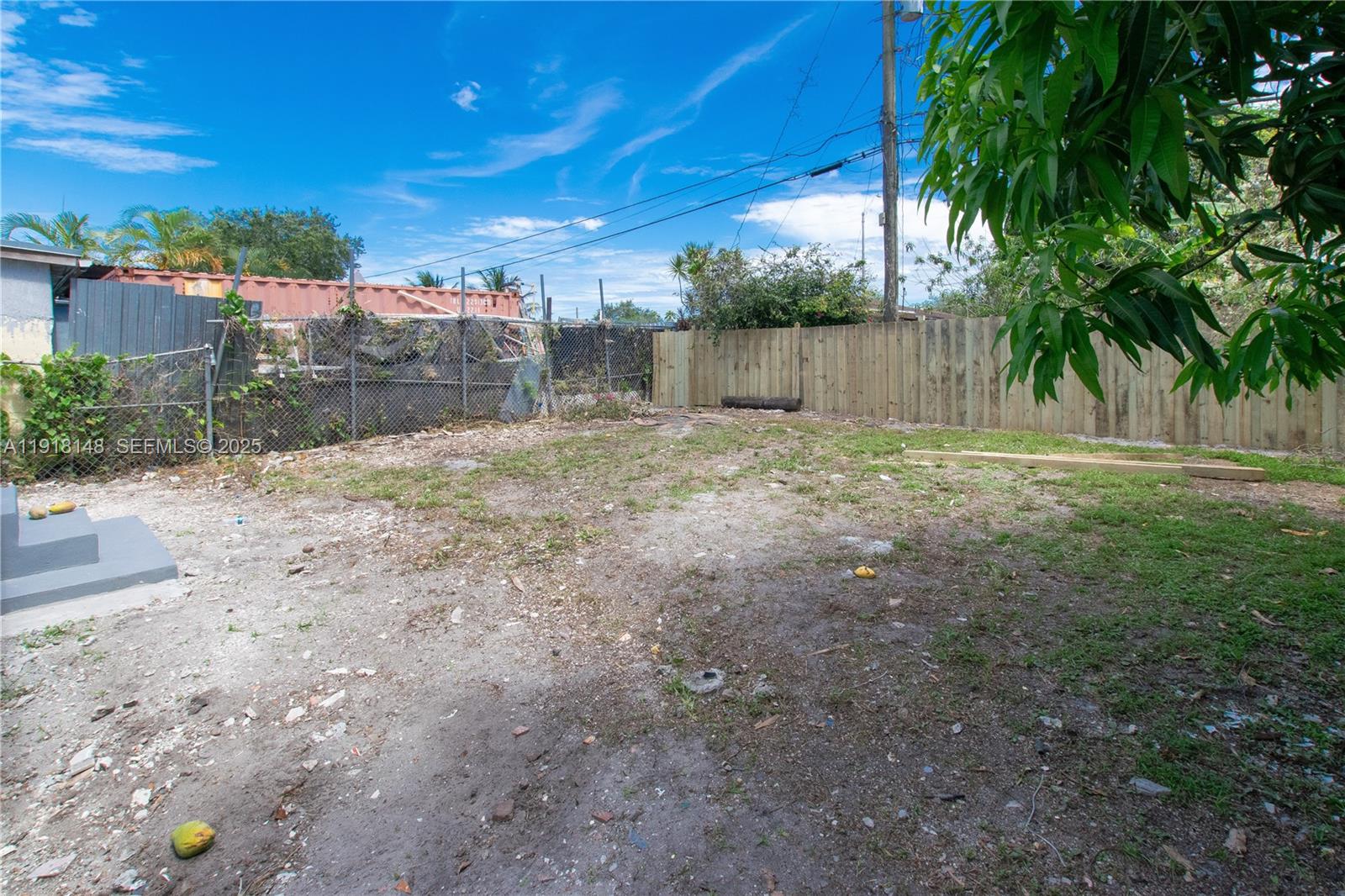 2250 Northwest 95th Terrace Miami, FL 33147 - Photo 18 of 18 a view of a yard with a tree