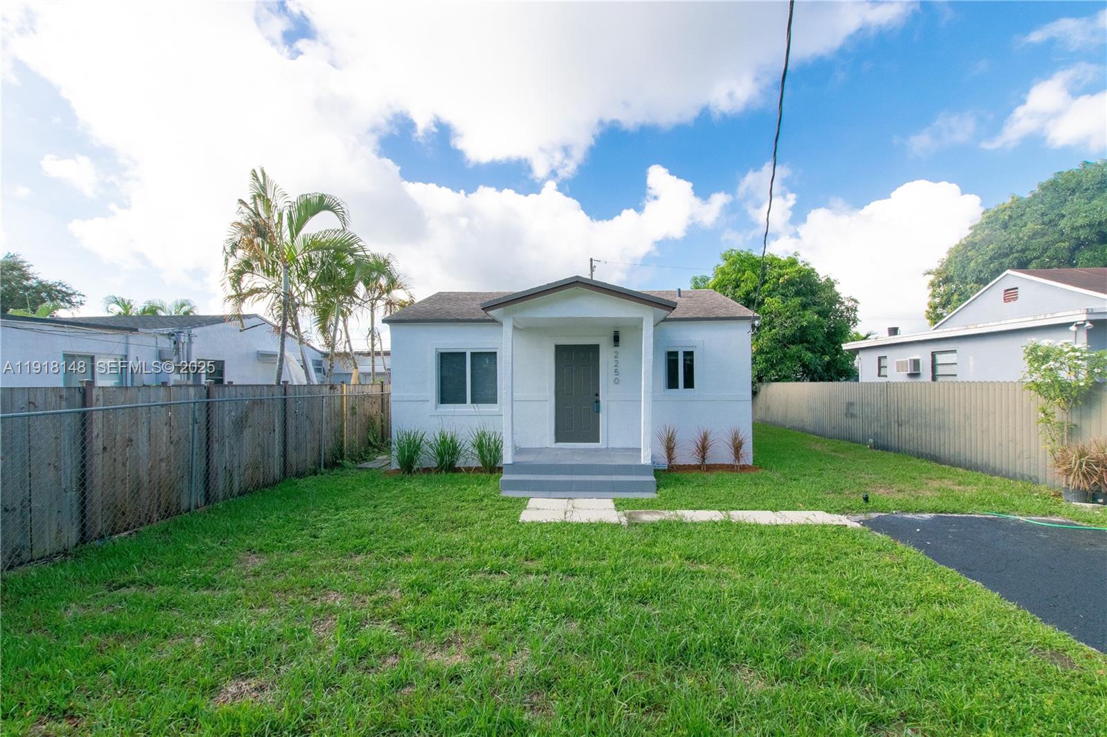 2250 Northwest 95th Terrace Miami, FL 33147 - Photo 2 of 18 a view of a backyard with a garden