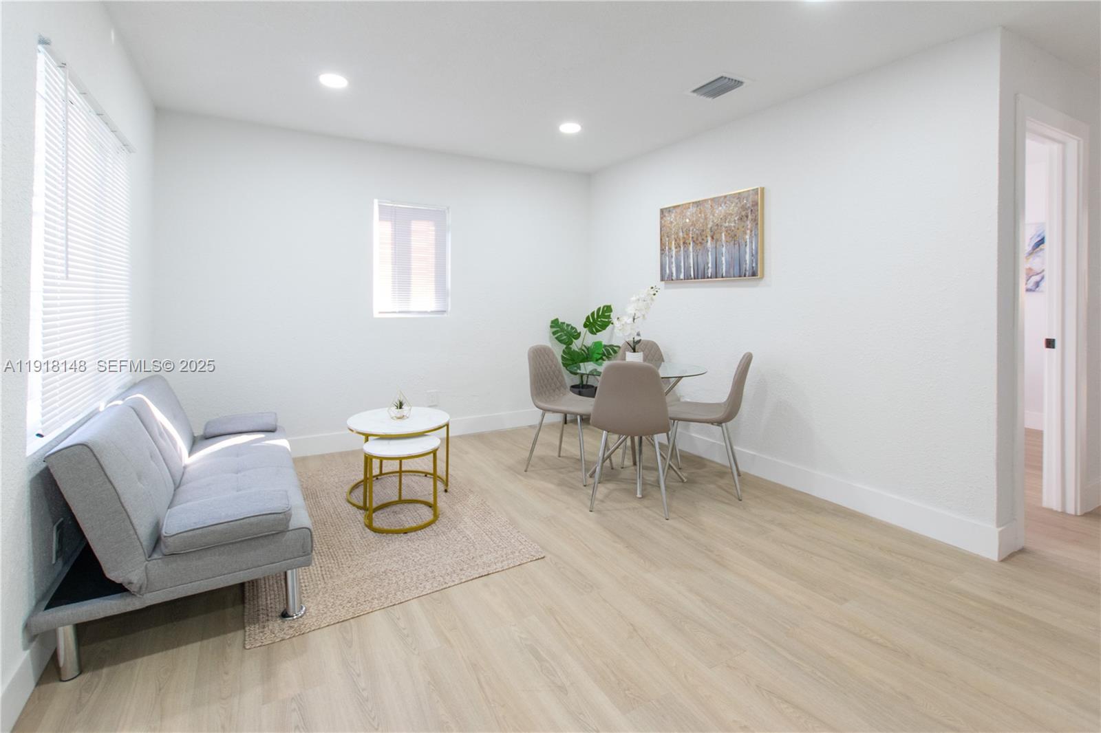 2250 Northwest 95th Terrace Miami, FL 33147 - Photo 5 of 18 a living room with furniture and a table