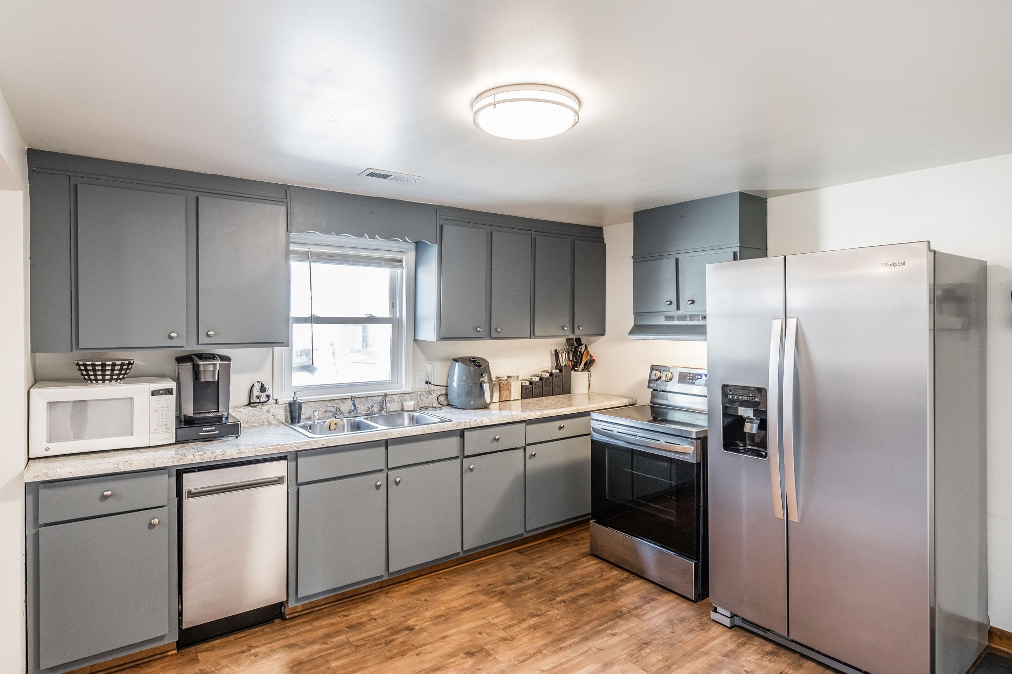 145 New Deal Potts Road Cottontown, TN 37048 - Photo 13 of 40 a kitchen with a sink stainless steel appliances and cabinets