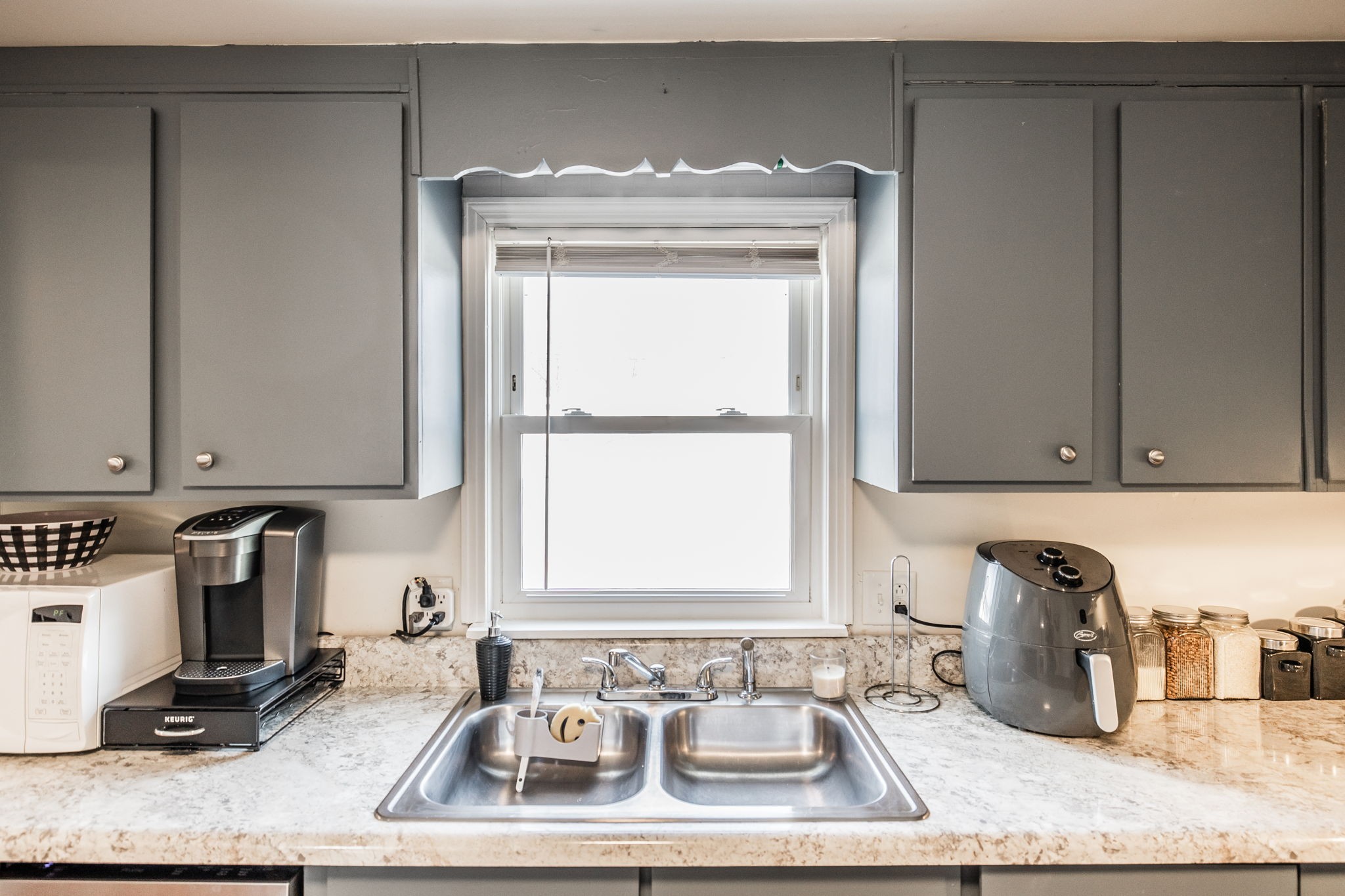 145 New Deal Potts Road Cottontown, TN 37048 - Photo 15 of 40 a bathroom with a granite countertop sink and a window