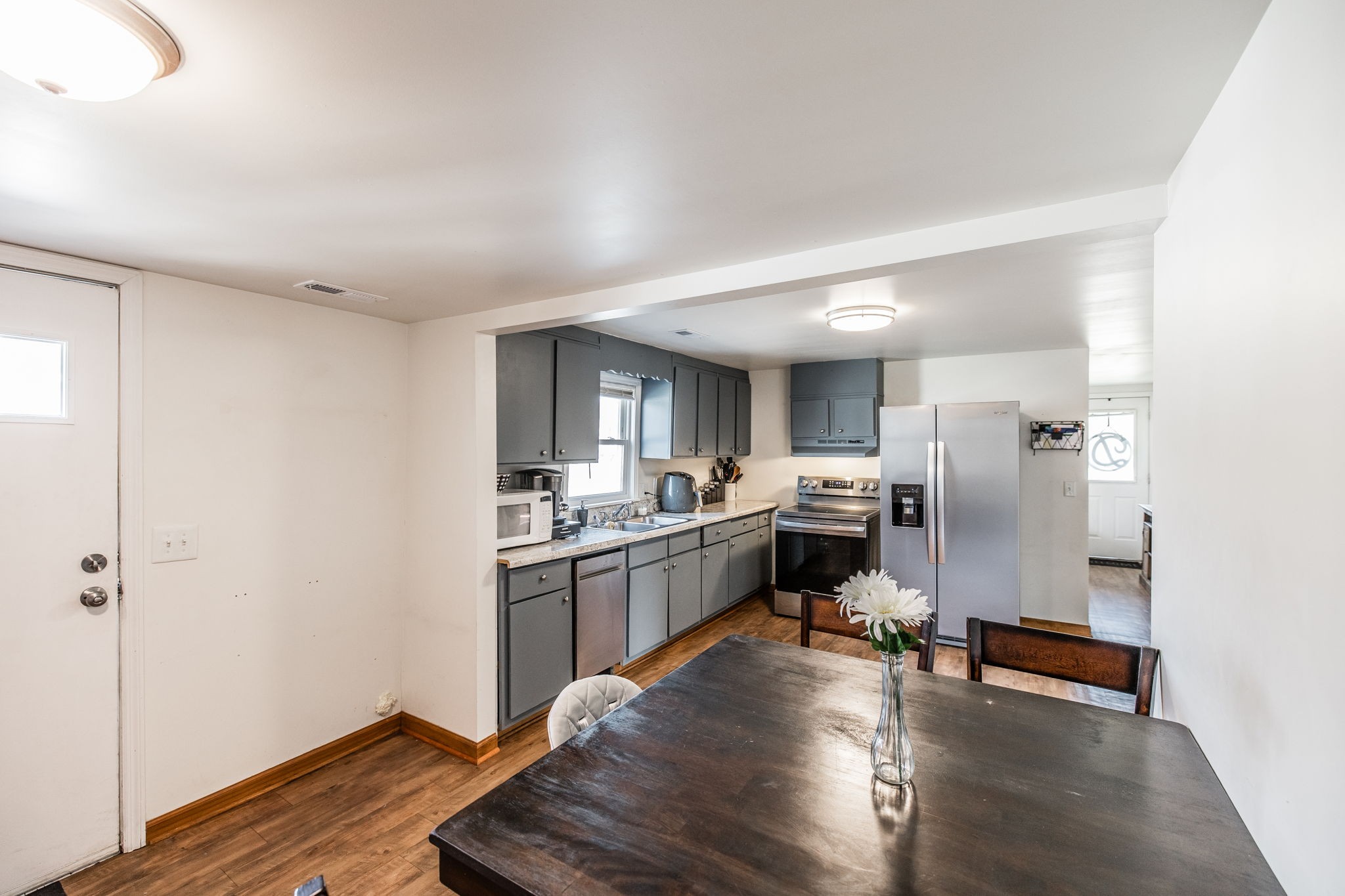 145 New Deal Potts Road Cottontown, TN 37048 - Photo 21 of 40 a kitchen with a sink appliances and wooden floor