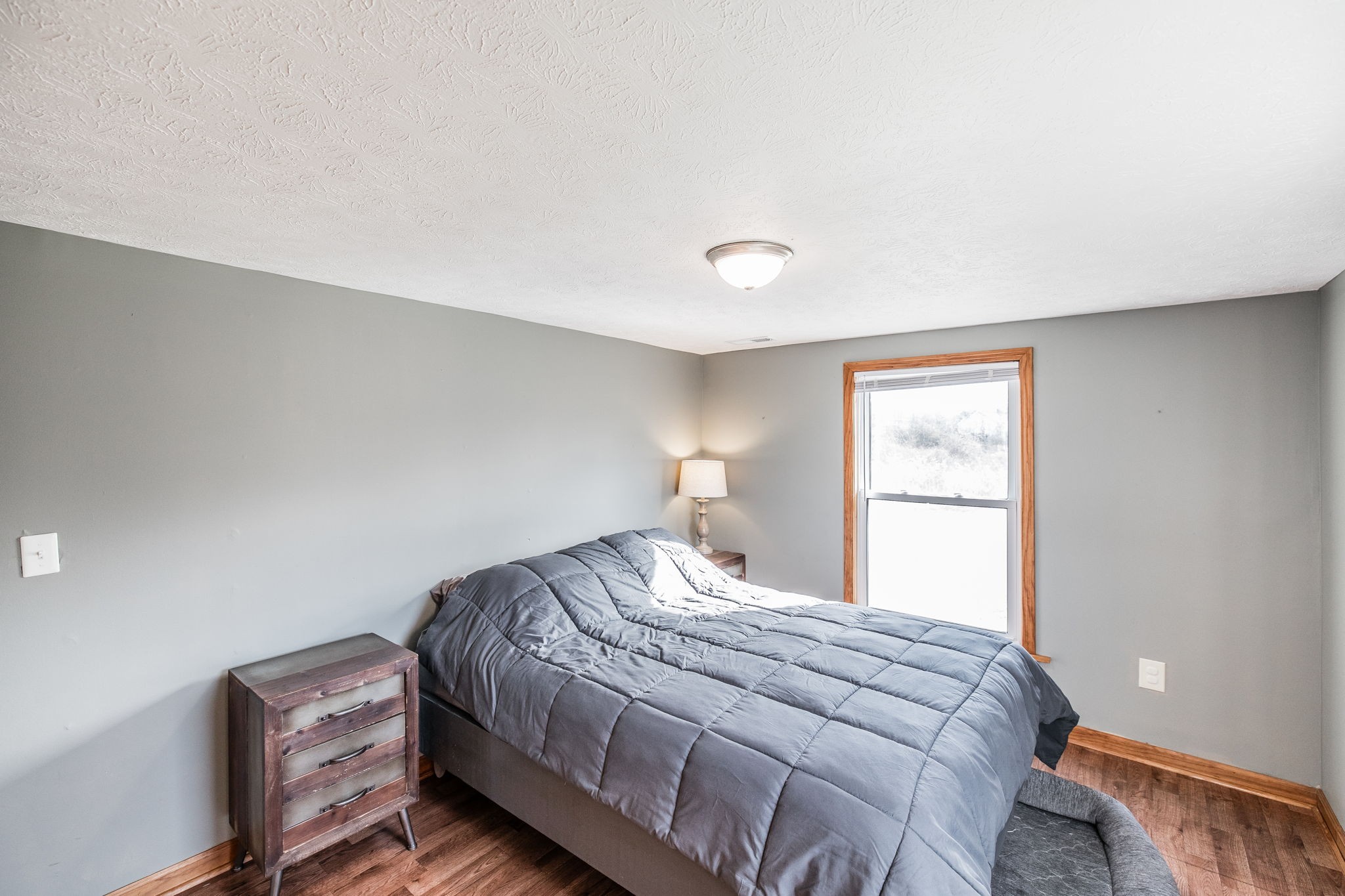 145 New Deal Potts Road Cottontown, TN 37048 - Photo 23 of 40 a bedroom with a bed and a window